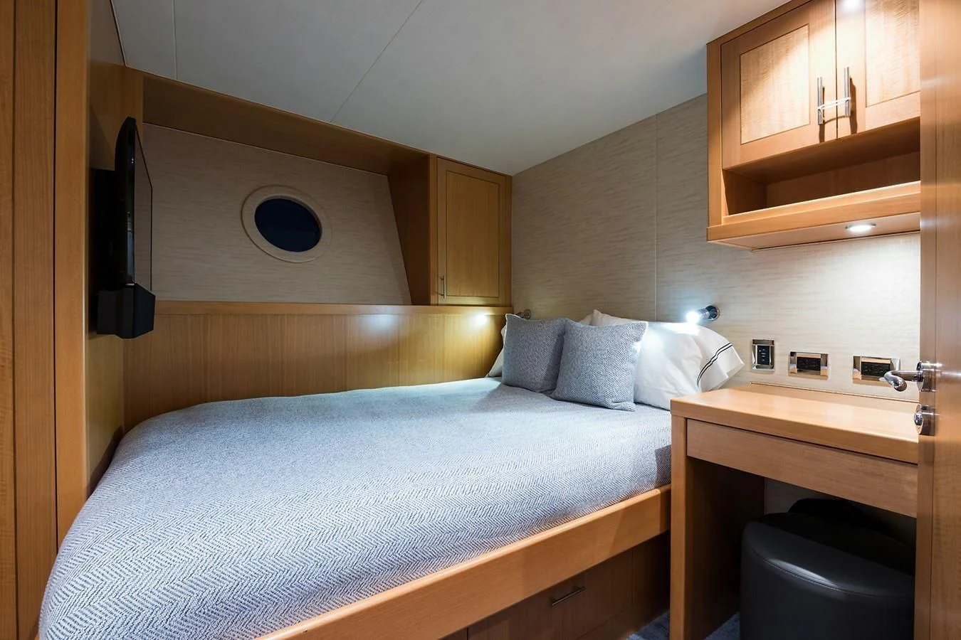 a bed with a white sheet aboard SERENITY Yacht for Sale