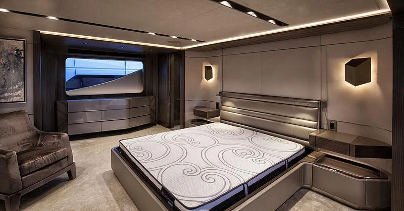 a room with a bed and a tv aboard SERENITY Yacht for Sale