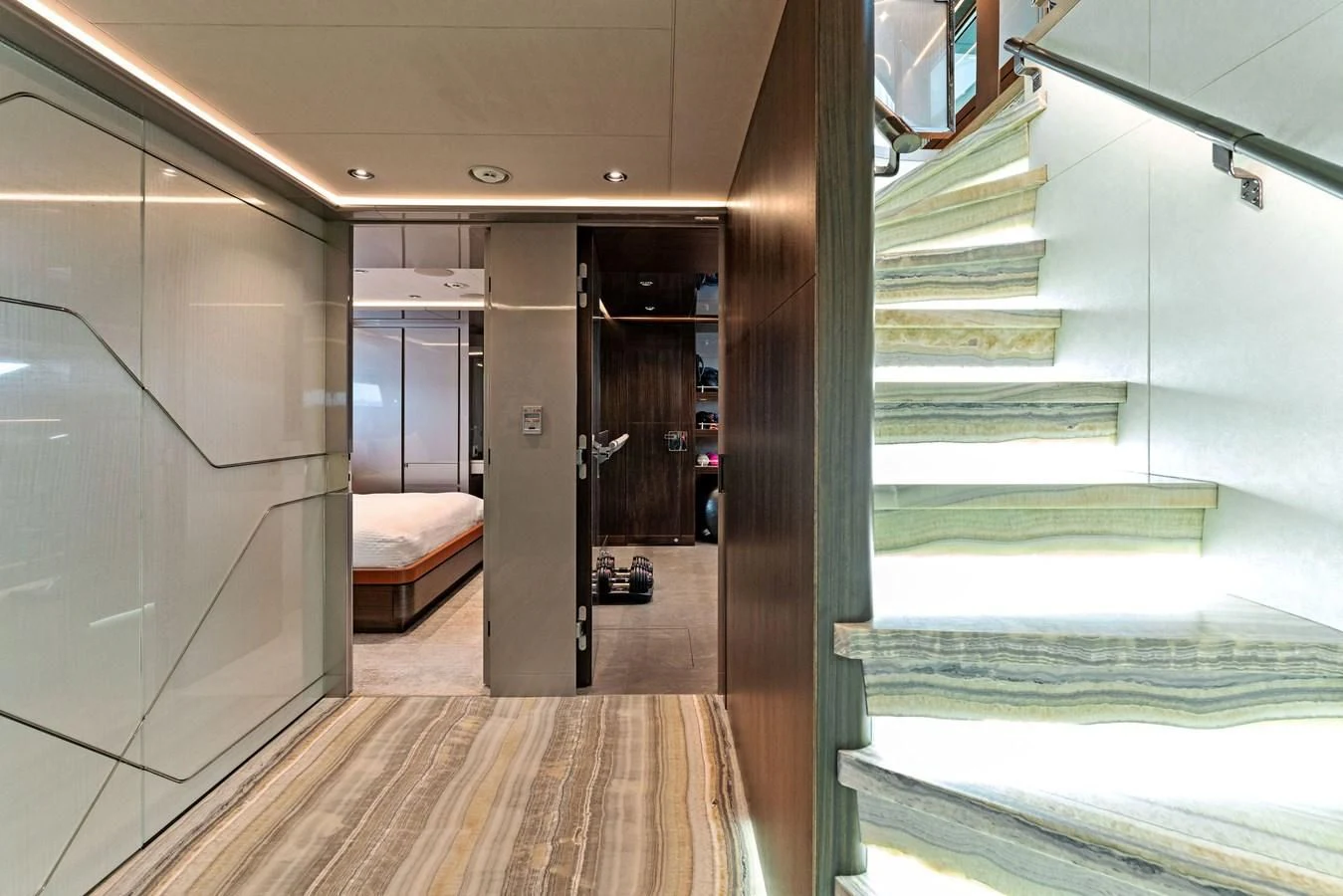 a room with a bed and a door aboard SERENITY Yacht for Sale