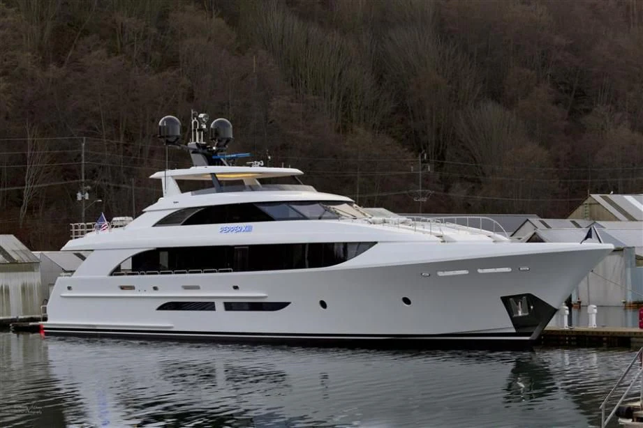 a white yacht in a lake aboard SERENITY Yacht for Sale
