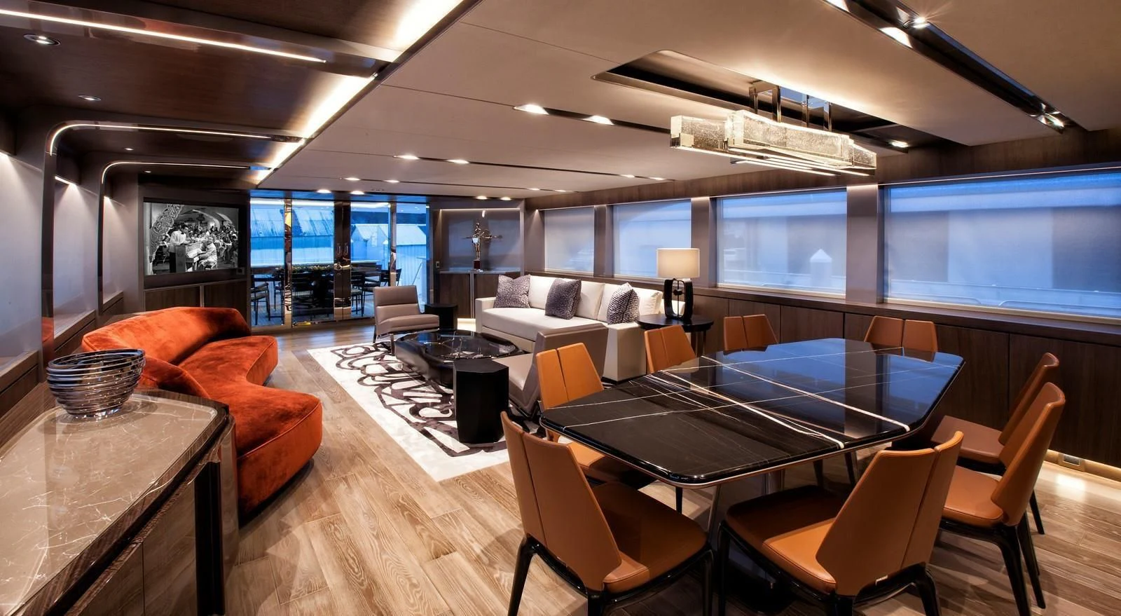 a room with a table and chairs aboard SERENITY Yacht for Sale