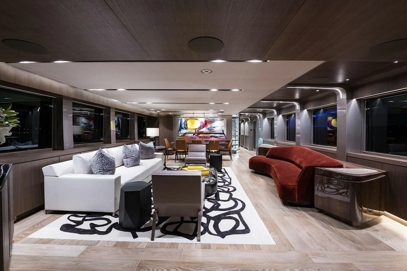 a living room with a couch and a coffee table aboard SERENITY Yacht for Sale