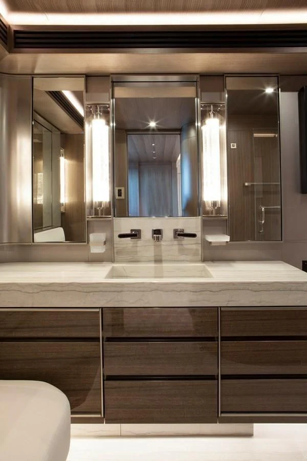 a bathroom with a large mirror aboard SERENITY Yacht for Sale