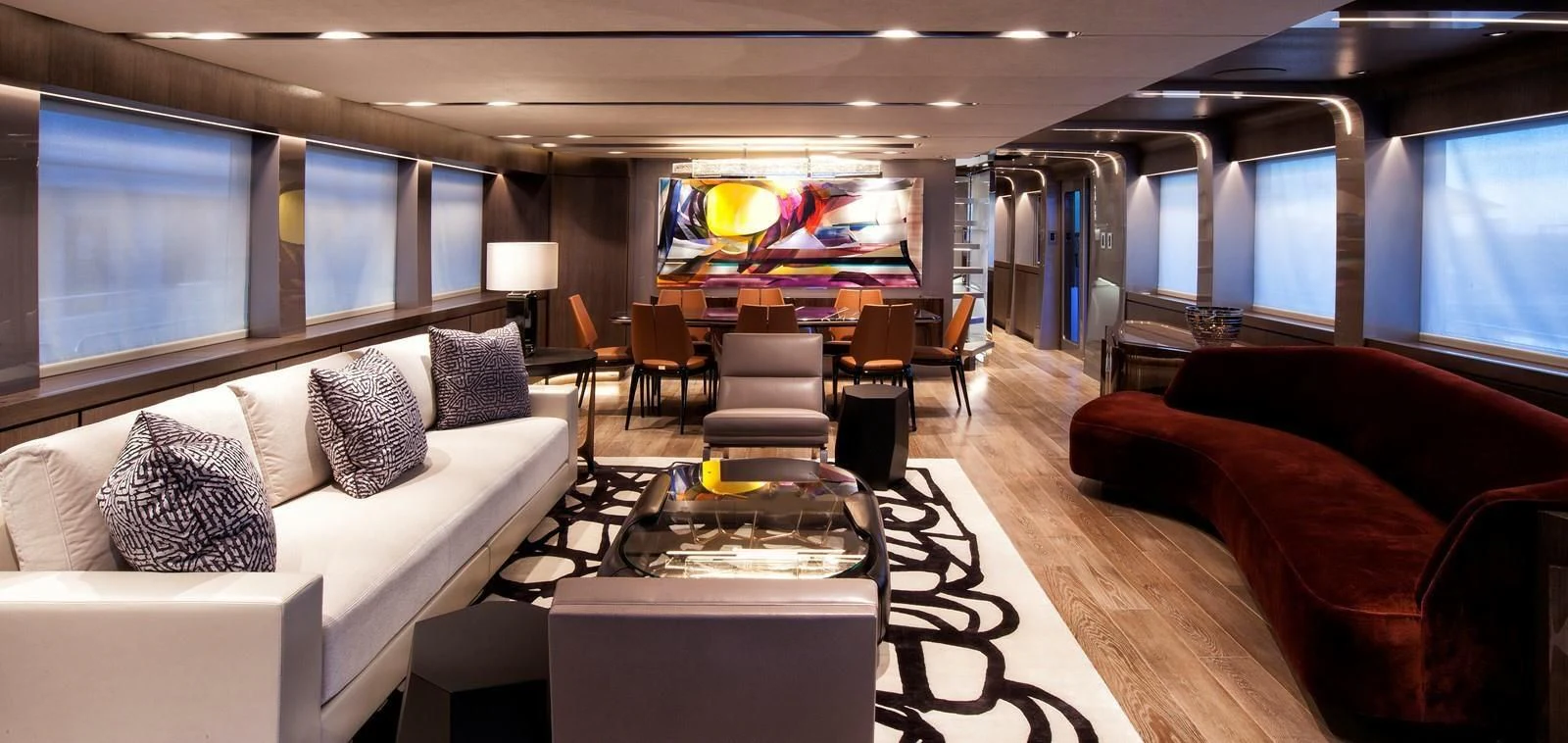 a room with a couch and a table and chairs aboard SERENITY Yacht for Sale