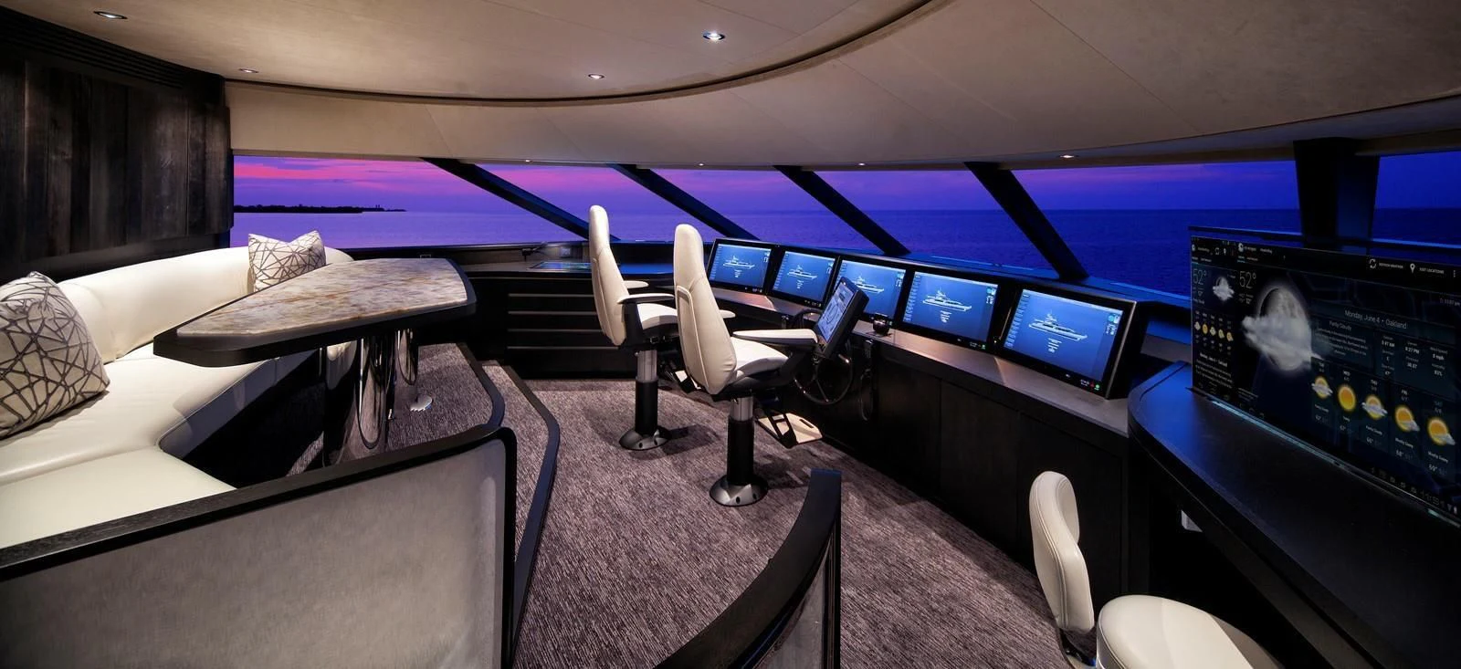 a room with a table and chairs aboard SERENITY Yacht for Sale