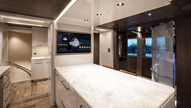 a large room with a large screen aboard SERENITY Yacht for Sale