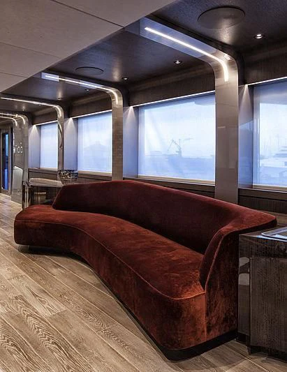 a couch in a room aboard SERENITY Yacht for Sale