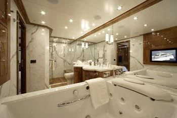 a bathroom with a large bathtub aboard DRAGON Yacht for Sale