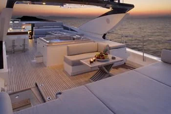 a room with a couch and a table and a window aboard DRAGON Yacht for Sale