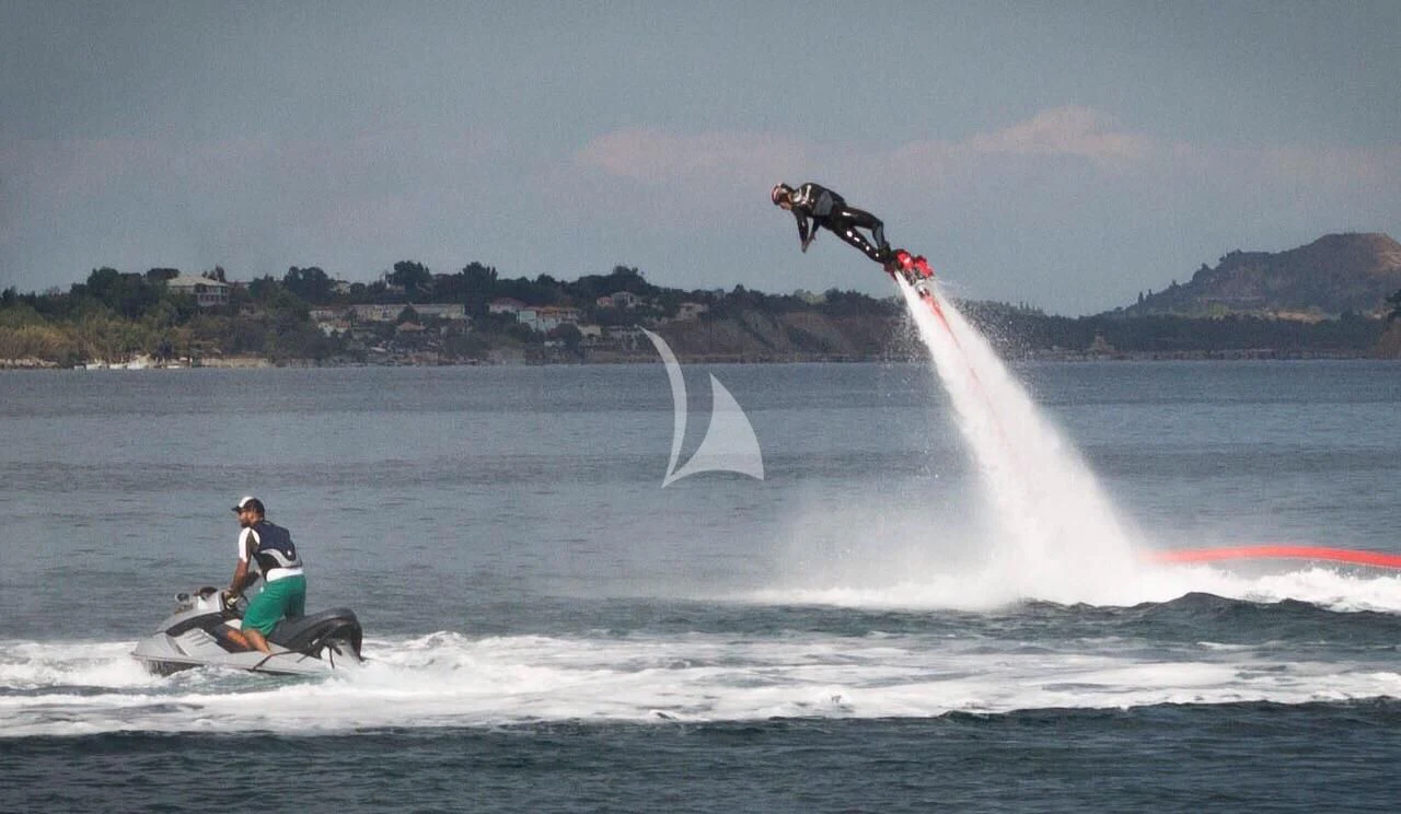 a man on a jet ski aboard DRAGON Yacht for Sale