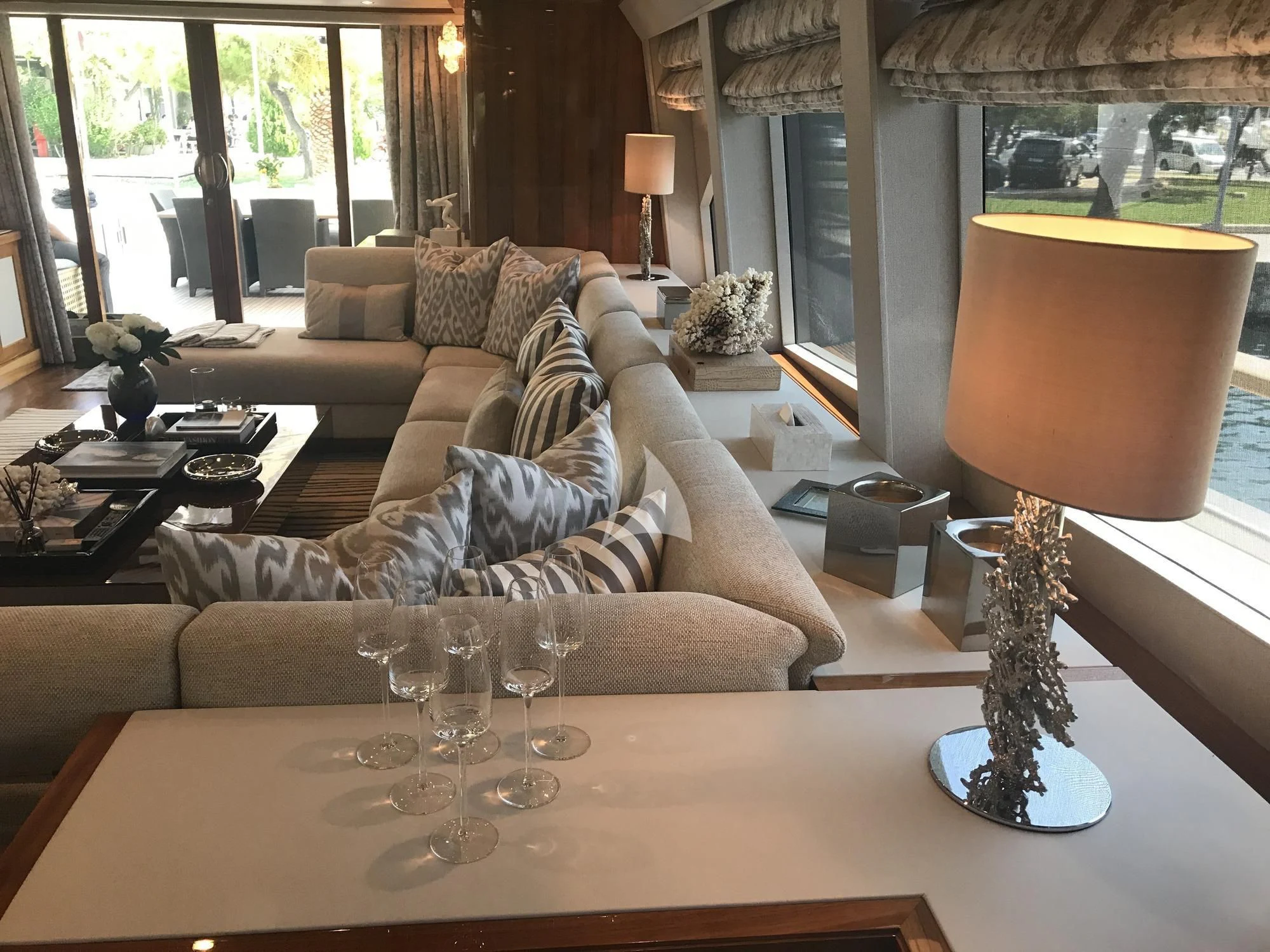 a living room with a large window aboard DRAGON Yacht for Sale