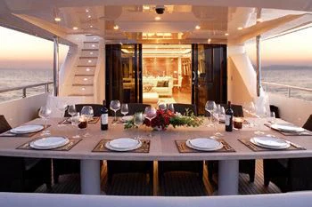 a table set for a dinner aboard DRAGON Yacht for Sale