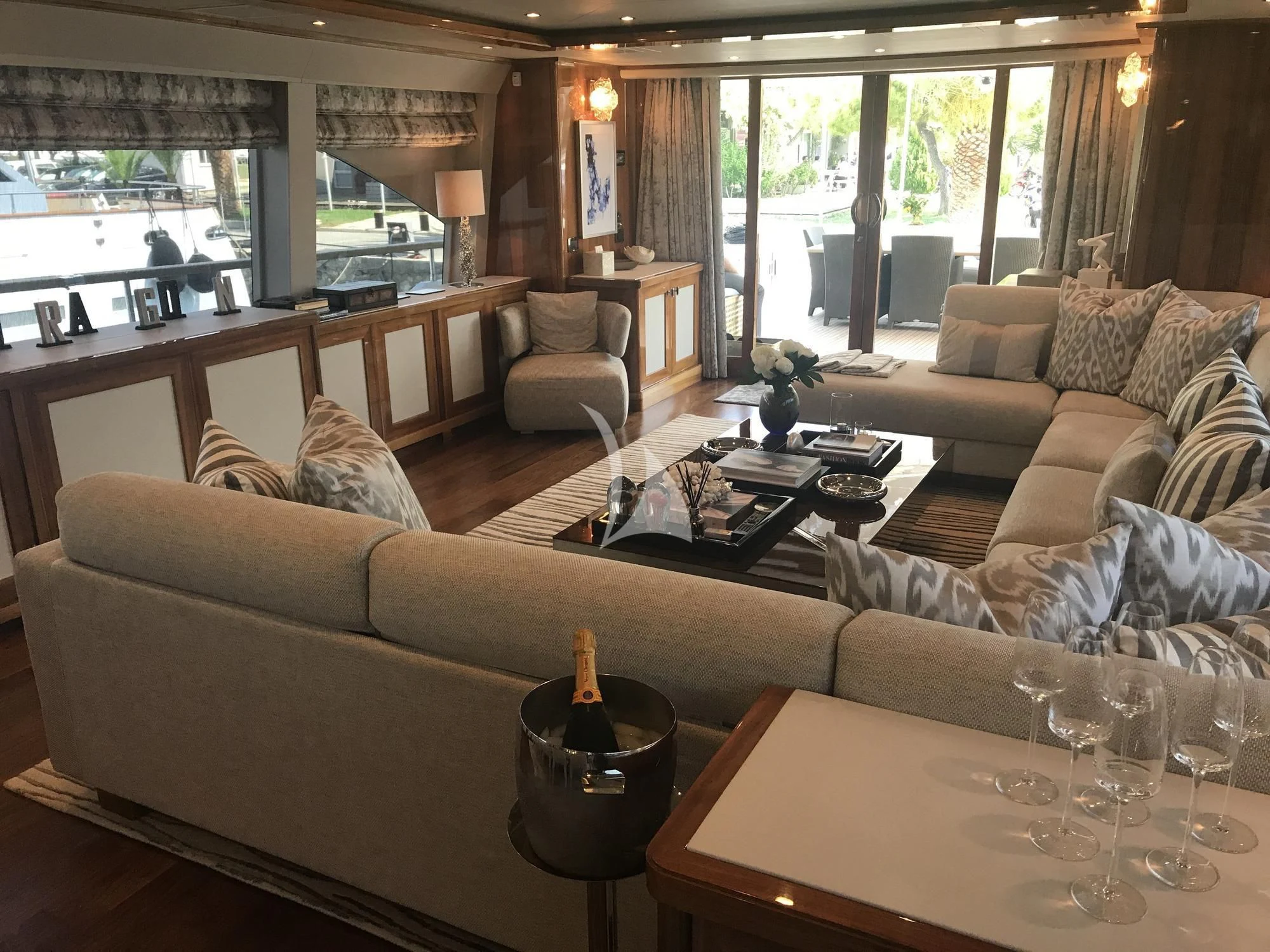 a living room with a large window aboard DRAGON Yacht for Sale