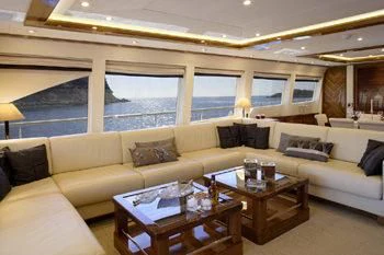 a living room with a large window aboard DRAGON Yacht for Sale