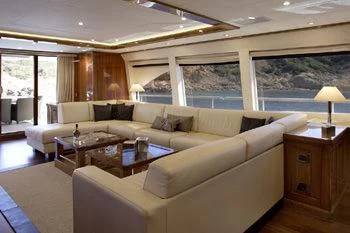 a living room with a large window aboard DRAGON Yacht for Sale