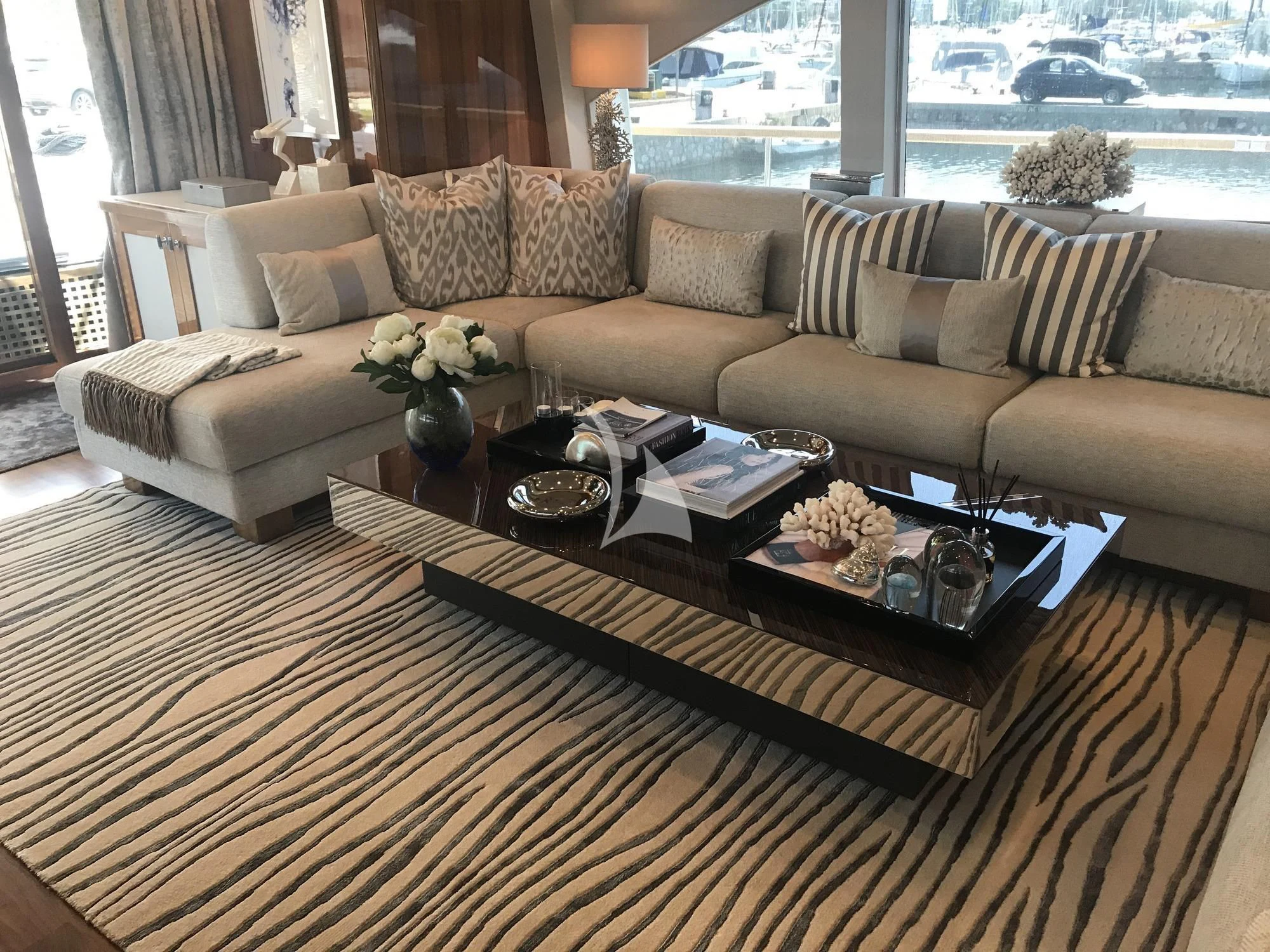 a living room with a couch and a coffee table aboard DRAGON Yacht for Sale
