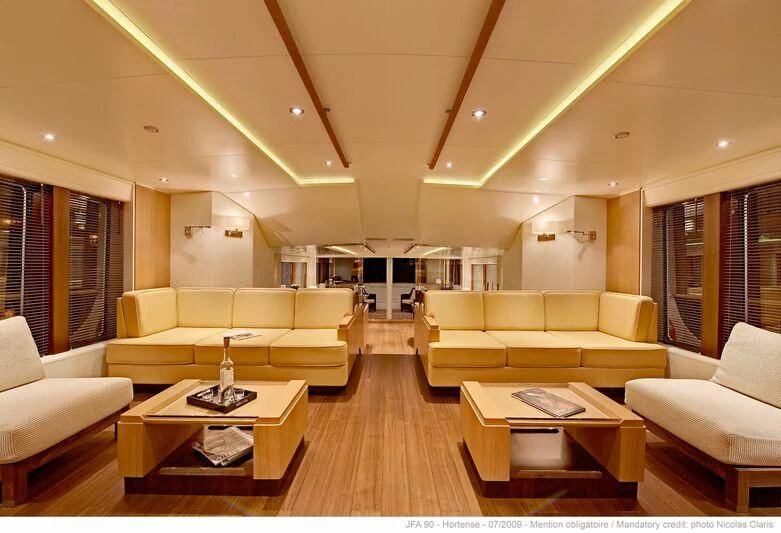 a living room with a wood floor aboard HORTENSE Yacht for Sale