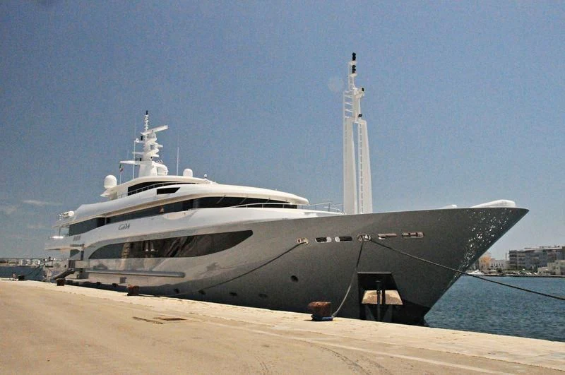 a large ship docked on a beach aboard CONSTANCE Yacht for Sale