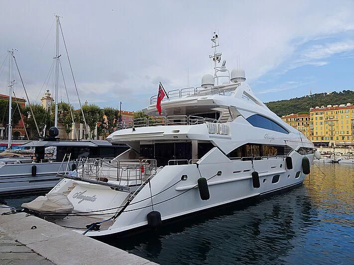 a couple of boats are parked in a harbor aboard ANYUTA Yacht for Sale