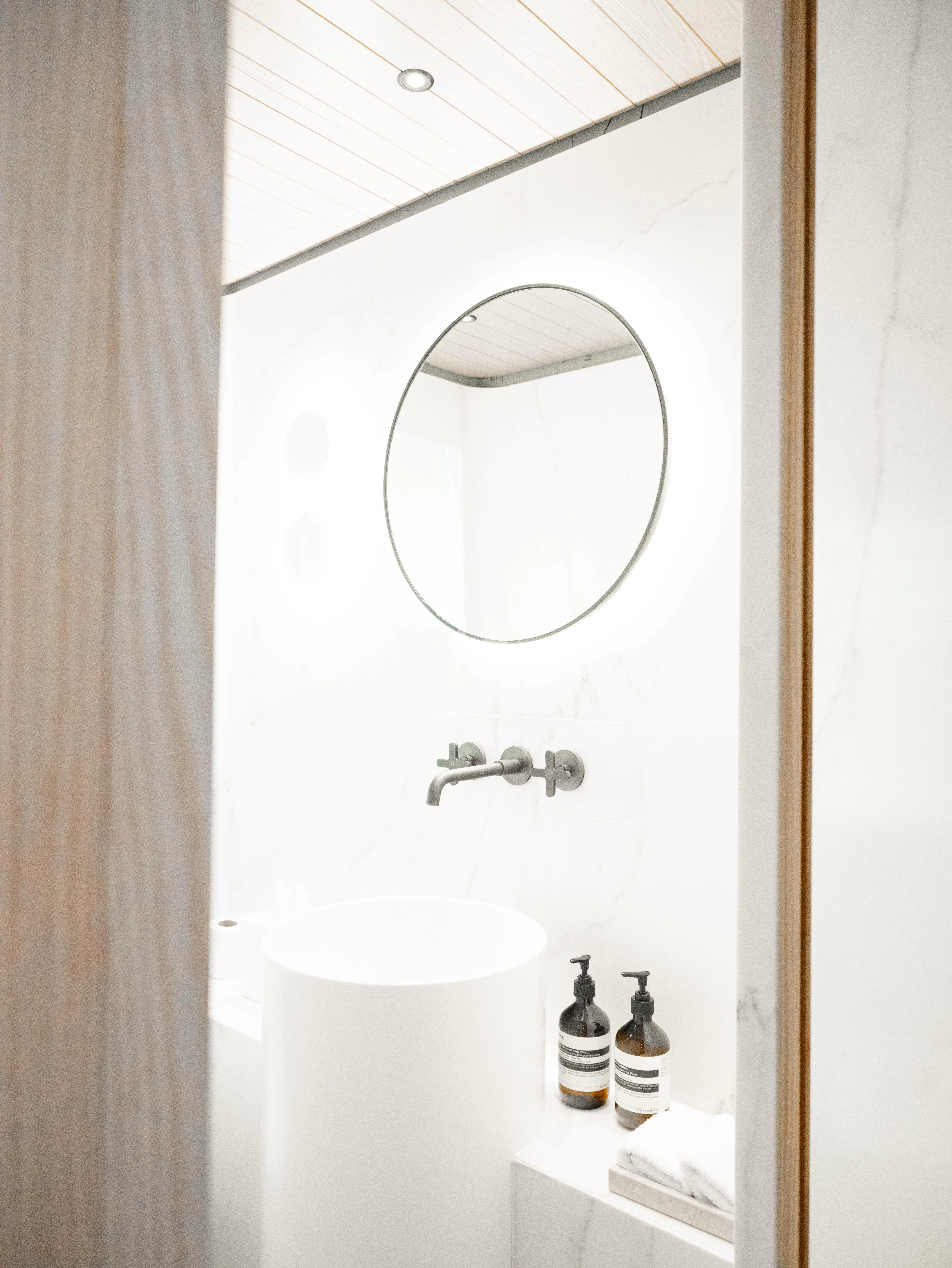 a mirror above a sink aboard VIRTUOSITY Yacht for Sale