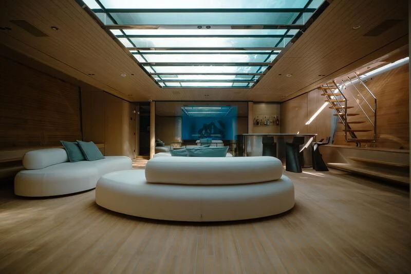 a room with a couch and a table aboard VIRTUOSITY Yacht for Sale