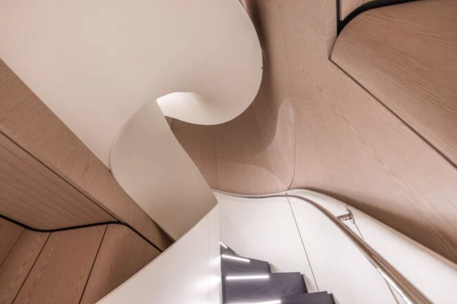 a white toilet with a seat aboard VIRTUOSITY Yacht for Sale