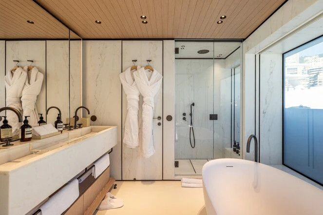 a bathroom with a large shower aboard VIRTUOSITY Yacht for Sale