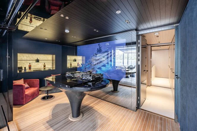 a room with a table and chairs aboard VIRTUOSITY Yacht for Sale