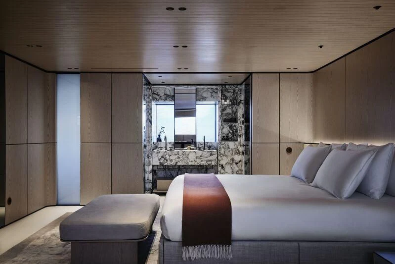 a room with a bed and a window aboard VIRTUOSITY Yacht for Sale