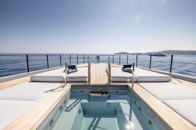 a deck with chairs on it aboard VIRTUOSITY Yacht for Sale