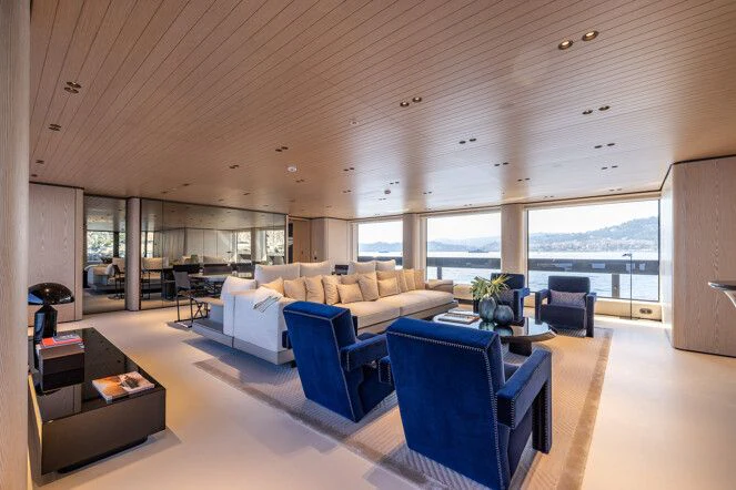 a living room with a large window aboard VIRTUOSITY Yacht for Sale