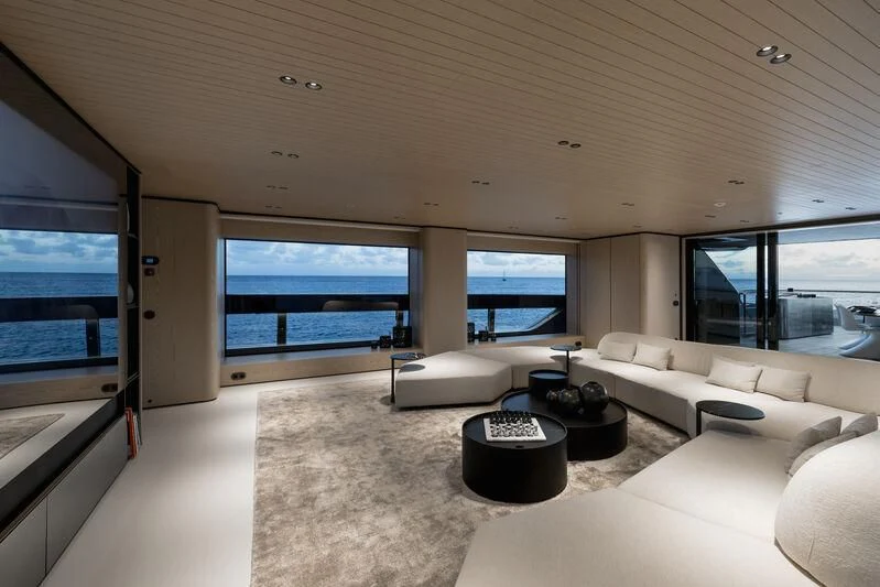 a living room with a large window aboard VIRTUOSITY Yacht for Sale