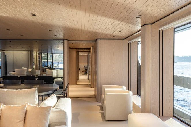 a living room with a large window aboard VIRTUOSITY Yacht for Sale