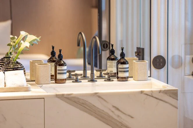 a bathroom sink with a flower in the window aboard VIRTUOSITY Yacht for Sale