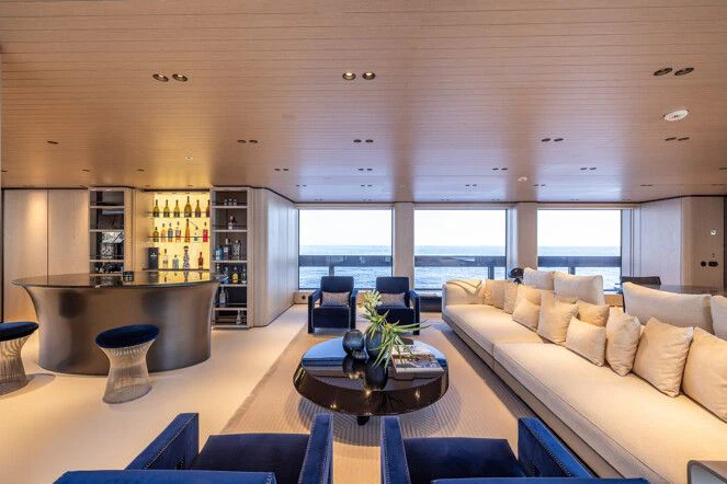 a living room with a large window aboard VIRTUOSITY Yacht for Sale