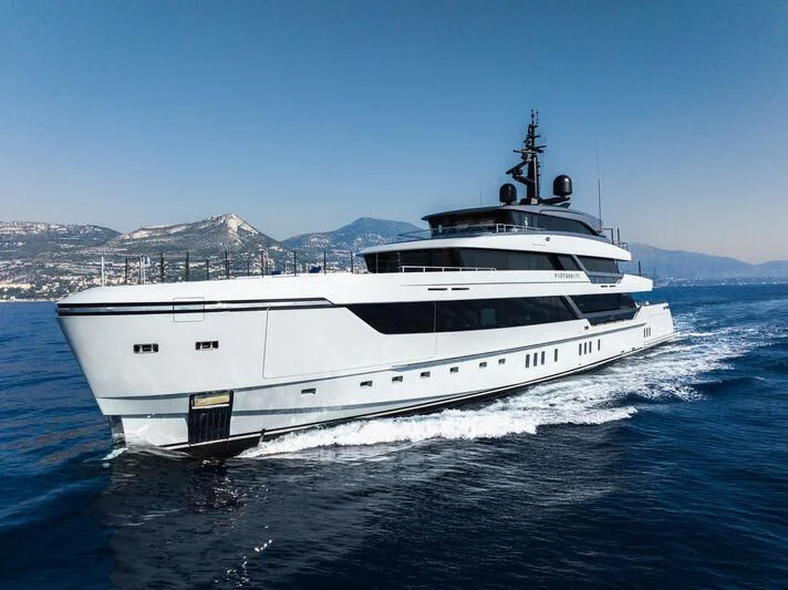 a white yacht on the water aboard VIRTUOSITY Yacht for Sale
