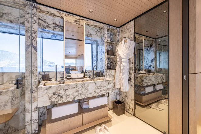 a bathroom with a large marble counter aboard VIRTUOSITY Yacht for Sale