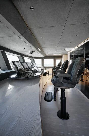 a room with a piano and chairs aboard VIRTUOSITY Yacht for Sale