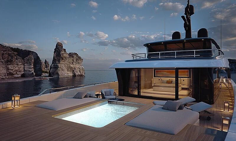 a large swimming pool next to a large rock formation aboard VIRTUOSITY Yacht for Sale