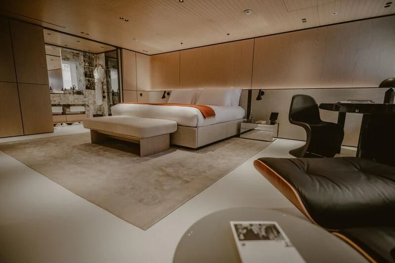 a room with a couch and a table aboard VIRTUOSITY Yacht for Sale
