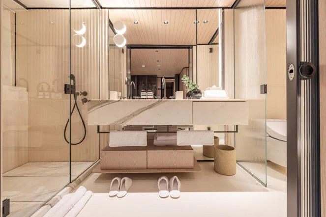 a bathroom with a large mirror aboard VIRTUOSITY Yacht for Sale