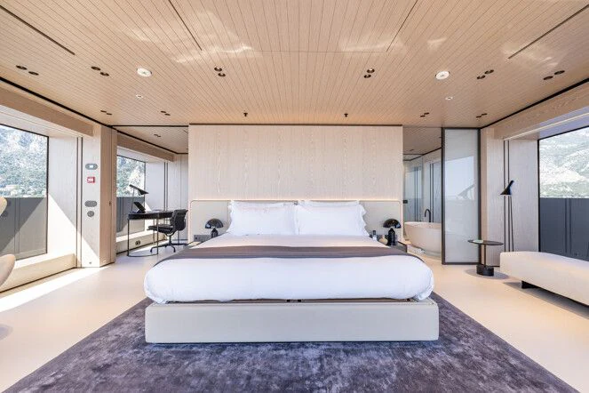 a large bed in a room aboard VIRTUOSITY Yacht for Sale