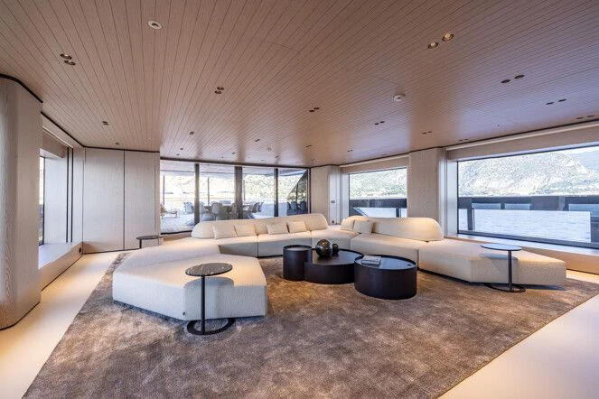 a large living room with a large window aboard VIRTUOSITY Yacht for Sale