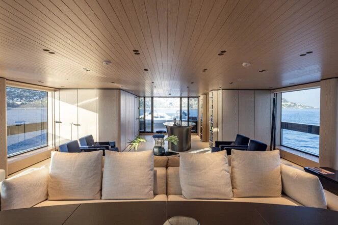 a living room with a large window aboard VIRTUOSITY Yacht for Sale