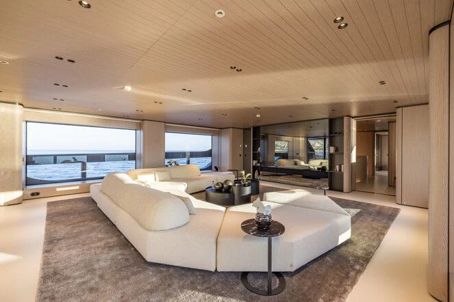 a living room with a large window aboard VIRTUOSITY Yacht for Sale
