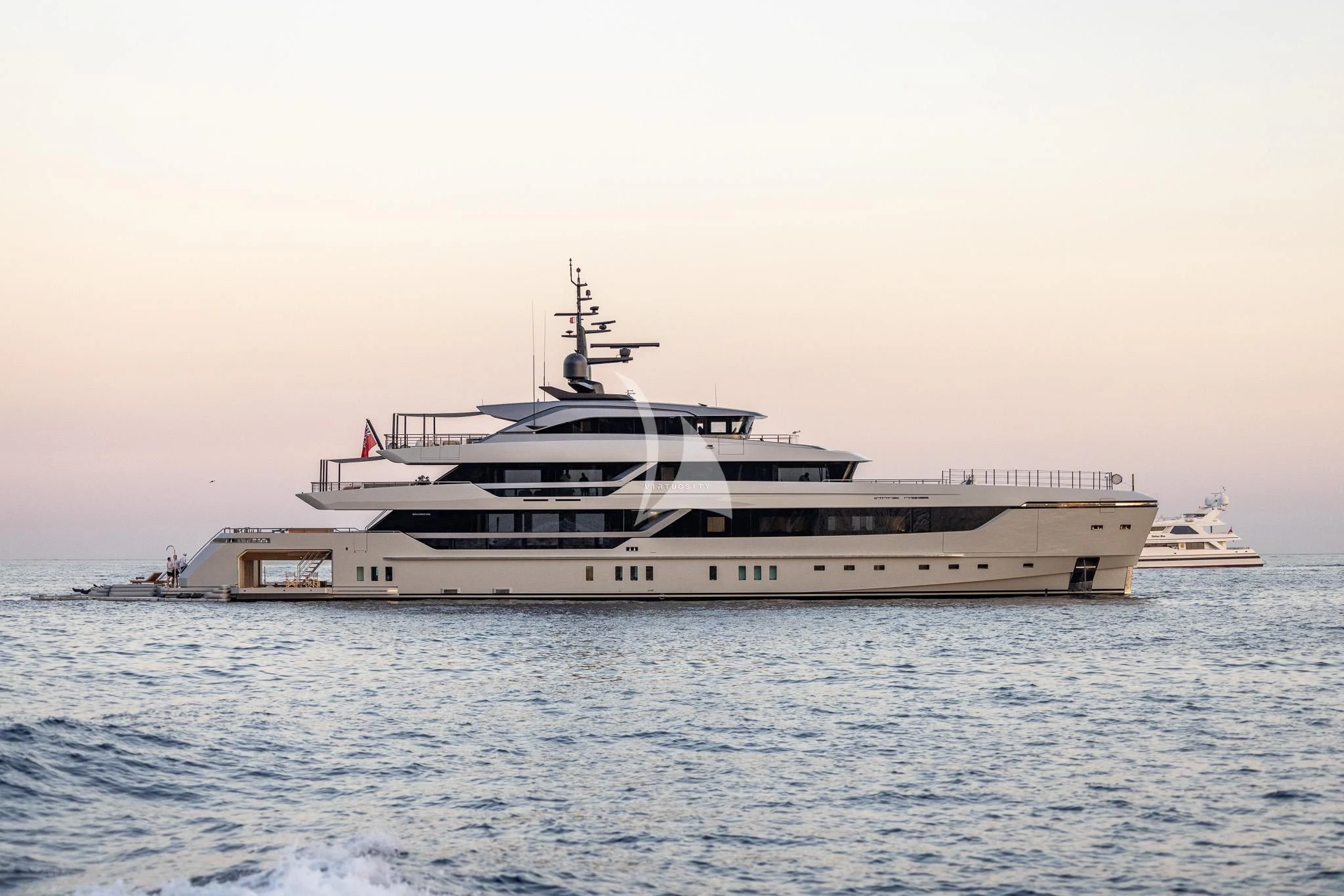 a white yacht in the water aboard VIRTUOSITY Yacht for Sale