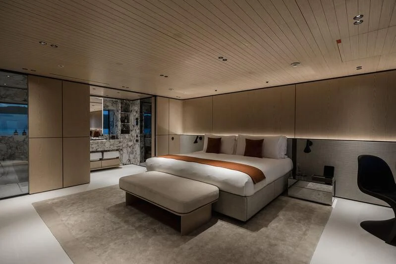 a room with a couch and a table aboard VIRTUOSITY Yacht for Sale