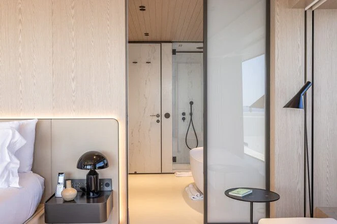 a bathroom with a sink and a mirror aboard VIRTUOSITY Yacht for Sale