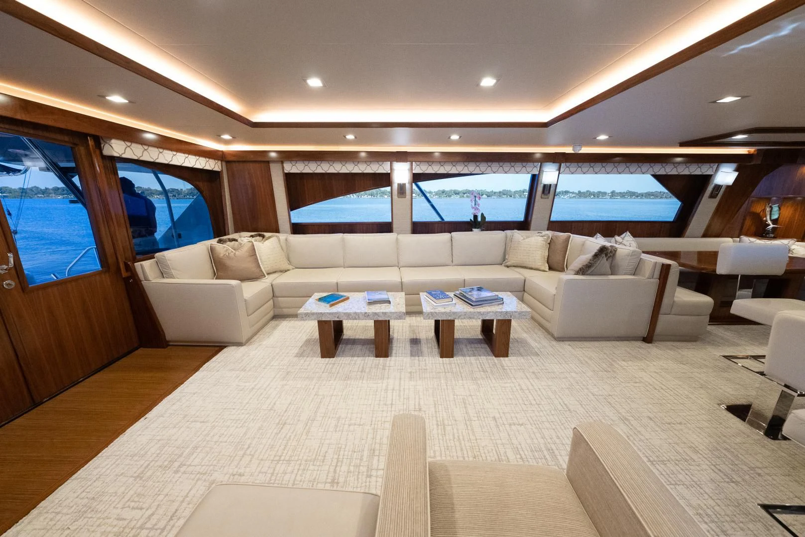 a living room with a large window aboard SIR' REEL Yacht for Sale