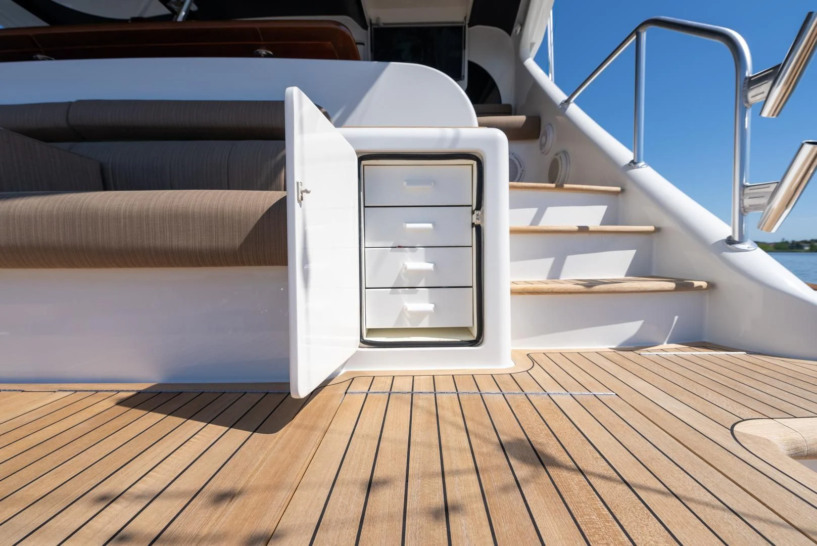 a white box on a wooden floor aboard SIR' REEL Yacht for Sale